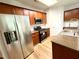Modern kitchen with stainless steel appliances and wooden cabinets at 5872 Oakbrook Lake Ct, Norcross, GA 30093