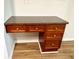 A granite-topped desk features wood cabinets and drawers for plenty of storage at 5872 Oakbrook Lake Ct, Norcross, GA 30093