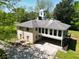 Aerial view of home showcasing the backyard, sunroom and mature trees at 11433 Panhandle Rd, Hampton, GA 30228