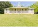 Charming home with a large porch and manicured front yard at 11433 Panhandle Rd, Hampton, GA 30228