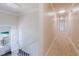 Bright hallway with neutral carpet, fresh paint, and abundant natural light at 11433 Panhandle Rd, Hampton, GA 30228