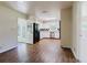 View of the kitchen featuring hardwood floors and access to the sun room at 11433 Panhandle Rd, Hampton, GA 30228