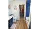 Bright bathroom features a toilet, vanity, tub, and an adjacent walk-in closet at 431 Crested View Dr, Loganville, GA 30052