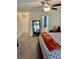 Spacious bedroom featuring a large mirror, ceiling fan, neutral carpet, and access to the ensuite bath at 431 Crested View Dr, Loganville, GA 30052