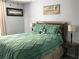 Well-lit bedroom showcases a large bed, stylish nightstands, and a relaxing atmosphere at 431 Crested View Dr, Loganville, GA 30052