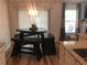 Cozy breakfast nook featuring a unique wooden table and bench set near a window with natural light at 431 Crested View Dr, Loganville, GA 30052