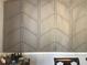 Close-up of the dining room's geometric accent wall, adding modern style to the home at 431 Crested View Dr, Loganville, GA 30052
