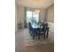 Elegant dining room with a large window, modern light fixture, and decorative wall at 431 Crested View Dr, Loganville, GA 30052