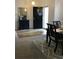 Cozy entryway featuring a dining table, mirror, and welcome sign on front door at 431 Crested View Dr, Loganville, GA 30052