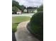 Front yard view showcasing manicured landscaping and a view of the neighborhood street at 431 Crested View Dr, Loganville, GA 30052