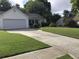 Well-manicured lawn and driveway leading to a two-car garage at 431 Crested View Dr, Loganville, GA 30052