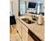 Granite kitchen countertop with stainless steel sink, white cabinets, and black dishwasher at 431 Crested View Dr, Loganville, GA 30052