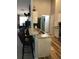 The kitchen features a breakfast bar, granite countertops, and stainless steel appliances at 431 Crested View Dr, Loganville, GA 30052
