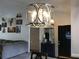 Stylish living room featuring a modern chandelier and a collection of art, blending comfort and sophistication at 431 Crested View Dr, Loganville, GA 30052