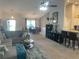 Open-concept living space flows into the dining area, showcasing stylish decor and comfortable seating at 431 Crested View Dr, Loganville, GA 30052