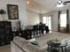 Open-concept living room featuring a breakfast bar, access to the patio, and comfortable seating at 431 Crested View Dr, Loganville, GA 30052