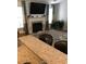 Bright living room showcasing a fireplace, large-screen television, and neutral decor at 431 Crested View Dr, Loganville, GA 30052