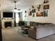 Cozy living room with a fireplace, modern decor, and a comfortable gray sectional couch at 431 Crested View Dr, Loganville, GA 30052