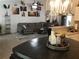 Open living space showcases a gray sectional, unique decor, and modern lighting at 431 Crested View Dr, Loganville, GA 30052