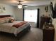Spacious main bedroom with a ceiling fan, a large window and neutral colored walls at 431 Crested View Dr, Loganville, GA 30052