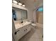 Bright bathroom with a vanity, toilet, shower/tub, and tiled floor at 504 Radford Ct, Woodstock, GA 30188