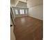 Spacious bedroom with hardwood floors, tray ceilings, and abundant natural light at 504 Radford Ct, Woodstock, GA 30188