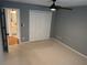 Bedroom with modern ceiling fan and spacious closet space at 504 Radford Ct, Woodstock, GA 30188