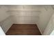 Walk-in closet with hardwood floors and wire shelving for storage at 504 Radford Ct, Woodstock, GA 30188