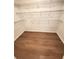 Walk-in closet featuring hardwood floors and white wire shelving at 504 Radford Ct, Woodstock, GA 30188