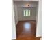 Empty dining room features a chair rail, hardwood floors, and lots of natural light at 504 Radford Ct, Woodstock, GA 30188
