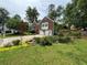 Beautiful home with meticulous landscaping, brick facade, and a two-car garage at 504 Radford Ct, Woodstock, GA 30188
