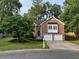 Inviting brick home boasts a well-maintained lawn and attached two-car garage at 504 Radford Ct, Woodstock, GA 30188