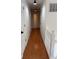 Hallway features hardwood floors and white trim at 504 Radford Ct, Woodstock, GA 30188