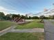 Community playground area with swings and play structure for outdoor fun at 504 Radford Ct, Woodstock, GA 30188