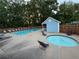 Outdoor pool with lounge chairs and nearby spa tub for relaxation and recreation at 504 Radford Ct, Woodstock, GA 30188