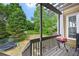 Back deck with a grill overlooking the backyard, perfect for outdoor cooking and entertaining at 75 Vinings Lake Sw Dr, Mableton, GA 30126