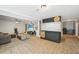 Spacious finished basement with tile flooring, a wet bar and cozy sitting area at 75 Vinings Lake Sw Dr, Mableton, GA 30126
