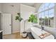Bright bathroom showcasing a soaking tub under a large window, complemented by a sleek, modern design at 75 Vinings Lake Sw Dr, Mableton, GA 30126