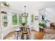 Eat-in breakfast nook featuring a pendant lamp, large windows and floating shelves at 75 Vinings Lake Sw Dr, Mableton, GA 30126