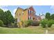 Charming two-story home with a well-manicured lawn and mature trees, offering curb appeal and a welcoming atmosphere at 75 Vinings Lake Sw Dr, Mableton, GA 30126