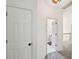 Hallway with an open doorway leading into a bathroom at 75 Vinings Lake Sw Dr, Mableton, GA 30126