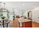 Modern kitchen featuring an island with granite countertops and stainless steel appliances and an eat-in breakfast nook at 75 Vinings Lake Sw Dr, Mableton, GA 30126
