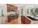 Modern kitchen with custom cabinetry, stainless steel appliances, and granite countertops at 75 Vinings Lake Sw Dr, Mableton, GA 30126