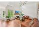 Inviting living room with a fireplace, high ceilings, hardwood floors, and large windows at 75 Vinings Lake Sw Dr, Mableton, GA 30126