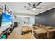Cozy living room with a large television, comfortable seating, and a modern entertainment center at 75 Vinings Lake Sw Dr, Mableton, GA 30126
