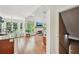 Bright, open living room with hardwood floors, large windows, and fireplace focal point at 75 Vinings Lake Sw Dr, Mableton, GA 30126