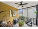 Relaxing screened-in porch with cozy seating, ideal for enjoying the outdoors in comfort and style at 75 Vinings Lake Sw Dr, Mableton, GA 30126