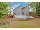 Home featuring wood back deck and a creek flowing through the backyard at 285 Camden Park Dr, Lawrenceville, GA 30046