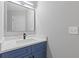 Modern bathroom featuring a sleek vanity with stylish sink, faucet, and a large mirror at 285 Camden Park Dr, Lawrenceville, GA 30046