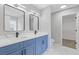 Bathroom with double vanity, modern fixtures, and hardwood flooring at 285 Camden Park Dr, Lawrenceville, GA 30046